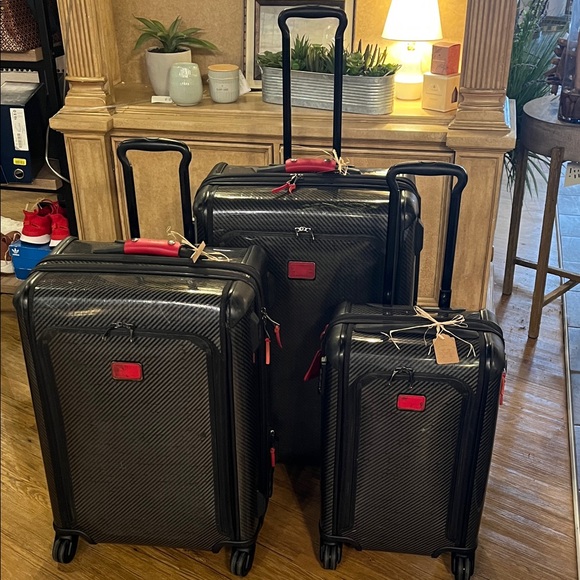 Tumi Handbags - Tumi Carbon Fiber Luggage Set with Red Accents- set for extra savings.